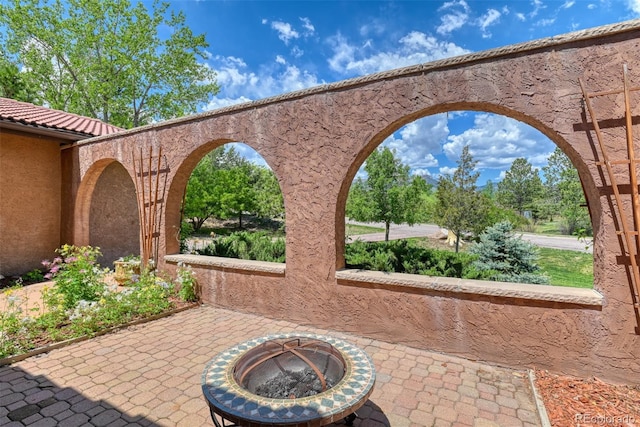 view of patio / terrace featuring a fire pit