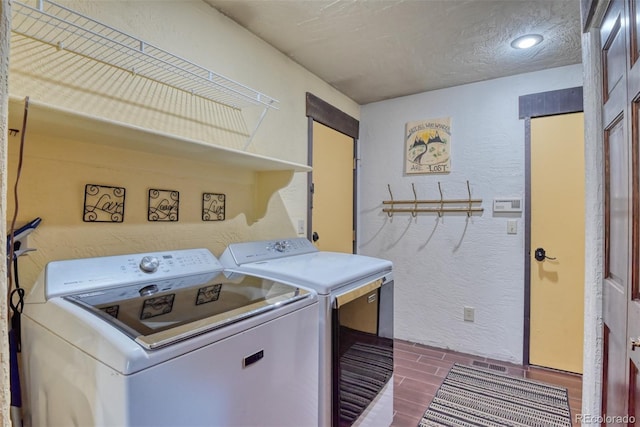 laundry area featuring washer and clothes dryer