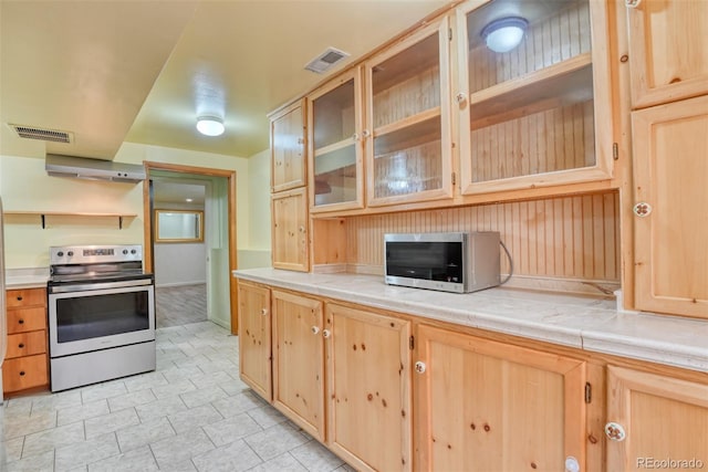 kitchen with stainless steel appliances and light brown cabinets