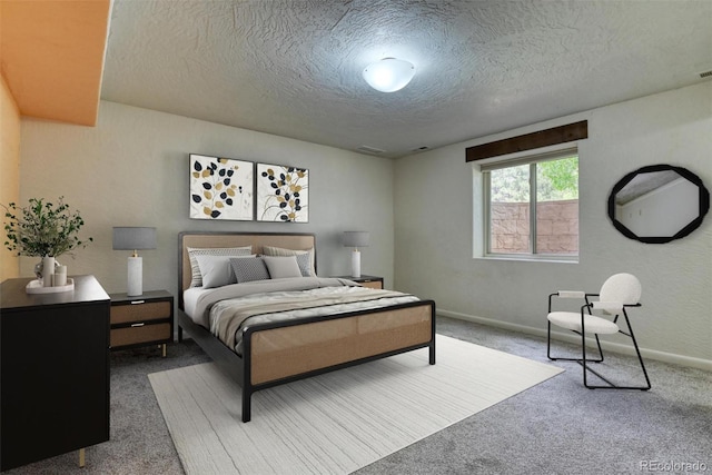 carpeted bedroom featuring a textured ceiling