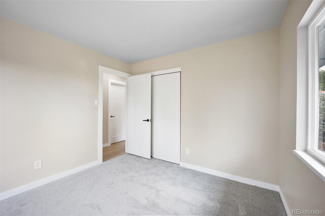 13249 W Jewell Pl, Lakewood, CO 80228 - unfurnished bedroom featuring carpet floors and a closet
