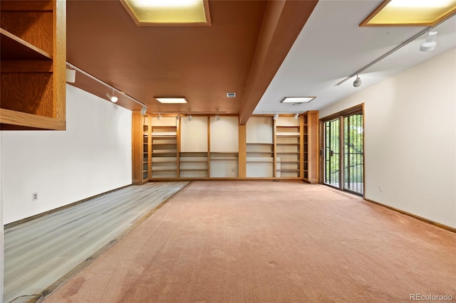 3900 Bogey Ct, Longmont, CO 80503 - spare room featuring track lighting and carpet flooring