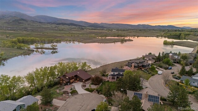 3900 Bogey Ct, Longmont, CO 80503 - aerial view at dusk of a water and mountain view