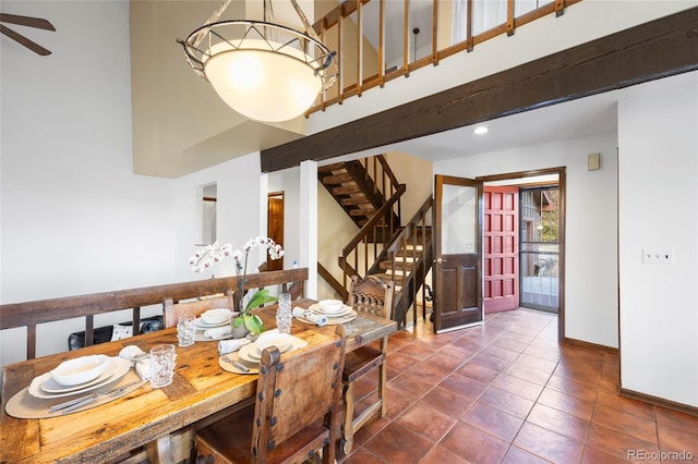 3900 Bogey Ct, Longmont, CO 80503 - tiled dining space featuring a towering ceiling, stairway, baseboards, ceiling fan, and recessed lighting