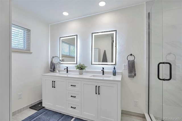 6179 S Bemis St, Littleton, CO 80120 - full bath with a shower stall, plenty of natural light, and double vanity