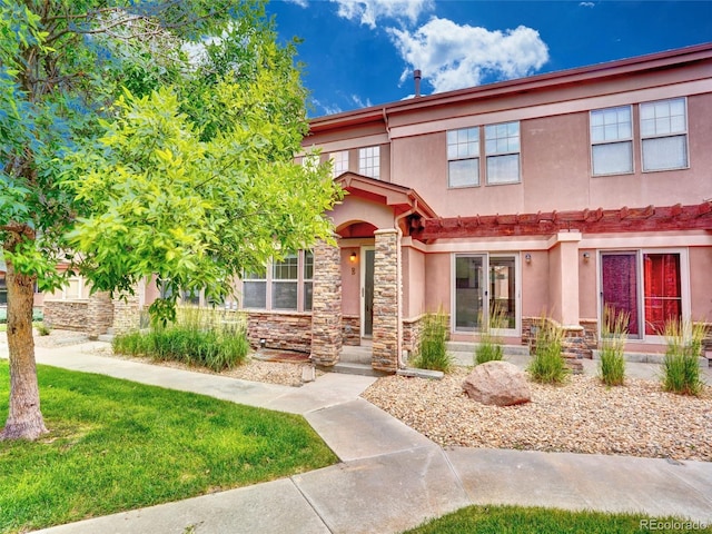 15501 E 112th Ave Unit 35B, Commerce City, CO 80022 - multi unit property with stucco siding, stone siding, and a front yard