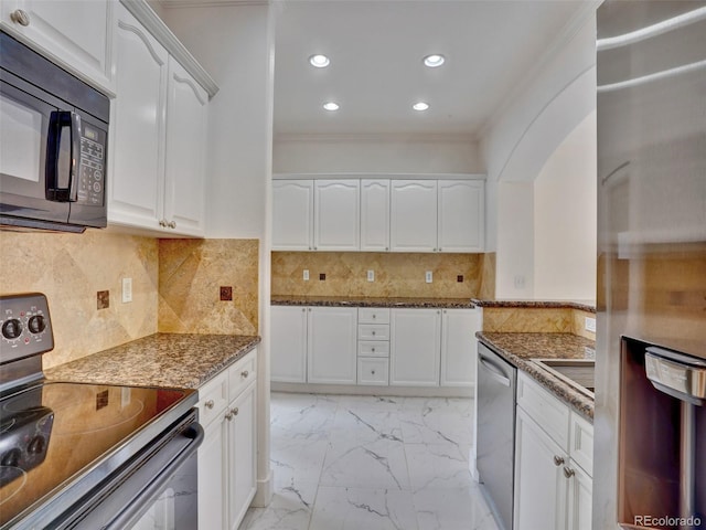 15501 E 112th Ave Unit 35B, Commerce City, CO 80022 - kitchen featuring black appliances, dark stone countertops, light marble finish floors, white cabinetry, and crown molding