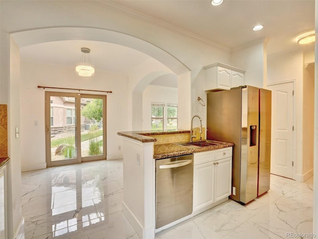 15501 E 112th Ave Unit 35B, Commerce City, CO 80022 - kitchen featuring appliances with stainless steel finishes, light marble finish floors, dark stone countertops, white cabinetry, and crown molding