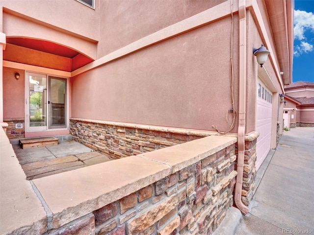 15501 E 112th Ave Unit 35B, Commerce City, CO 80022 - property entrance with stucco siding and stone siding