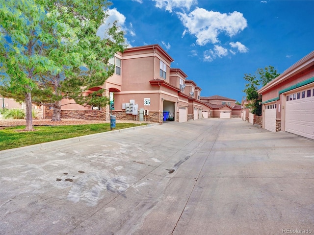 15501 E 112th Ave Unit 35B, Commerce City, CO 80022 - view of concrete road with community garages