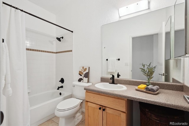 full bathroom with tile patterned flooring, vanity, shower / tub combo, and toilet