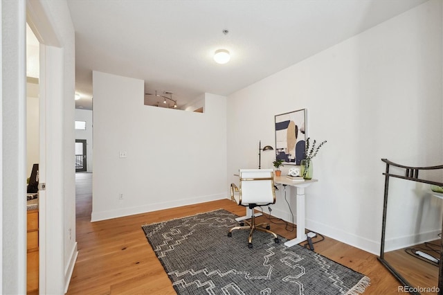 office with hardwood / wood-style floors