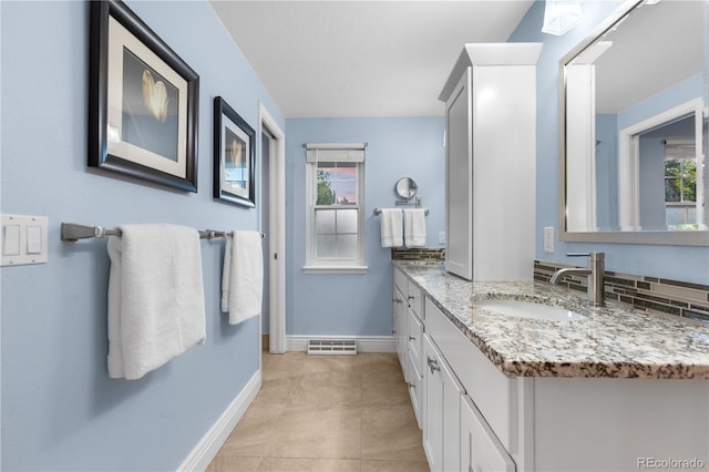 8535 E Otero Cir, Centennial, CO 80112 - bathroom with vanity, baseboards, and tile patterned flooring