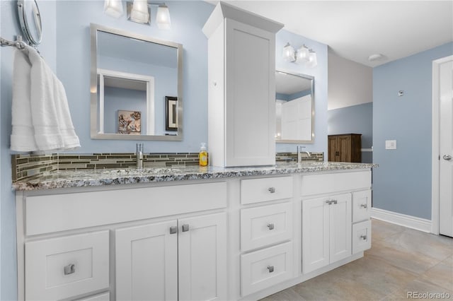 8535 E Otero Cir, Centennial, CO 80112 - full bath with double vanity and baseboards