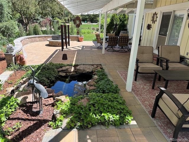 8535 E Otero Cir, Centennial, CO 80112 - view of patio / terrace with a garden pond, an outdoor fire pit, and outdoor dining area