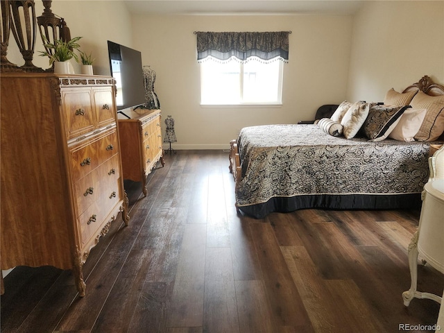 21924 E Lake Ave, Aurora, CO 80015 - bedroom with dark wood-style floors and baseboards