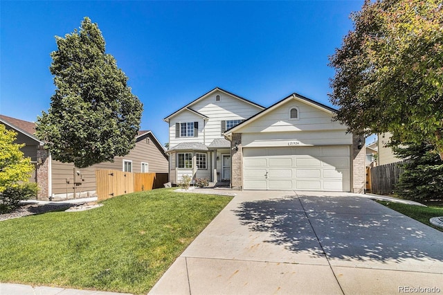 21924 E Lake Ave, Aurora, CO 80015 - traditional-style house with concrete driveway, an attached garage, and brick siding