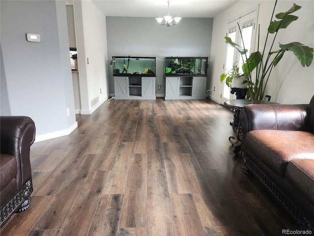 21924 E Lake Ave, Aurora, CO 80015 - living room featuring wood finished floors and a chandelier