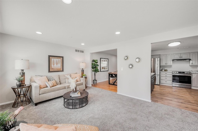 5947 W 65th Ave, Arvada, CO 80003 - living area featuring light carpet and recessed lighting
