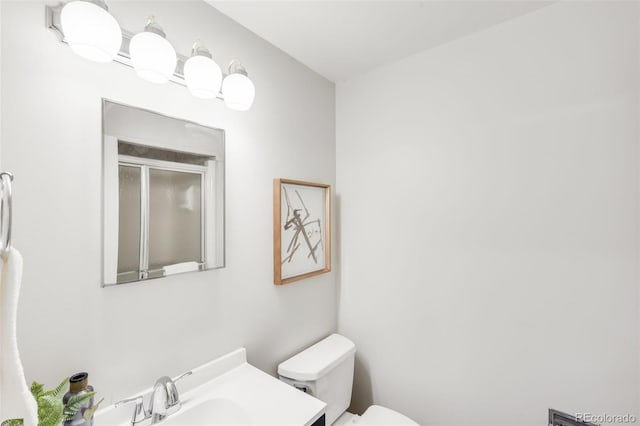5947 W 65th Ave, Arvada, CO 80003 - bathroom featuring a shower with door and vanity