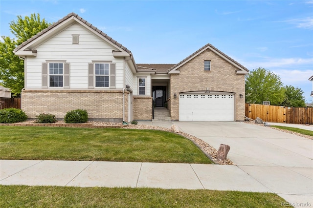 4545 Oxbow Dr, Brighton, CO 80601 - traditional home with brick siding, concrete driveway, a tile roof, and an attached garage