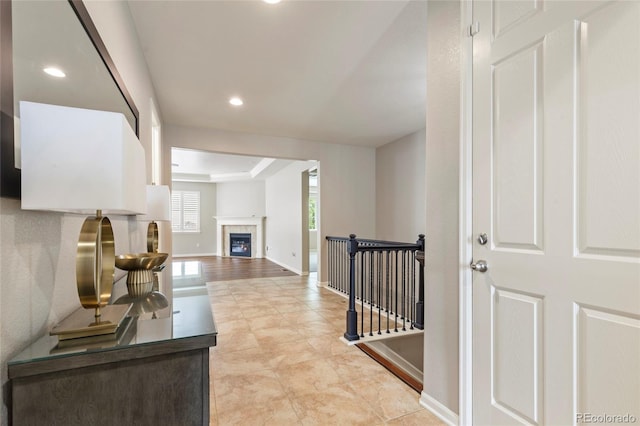 4545 Oxbow Dr, Brighton, CO 80601 - hallway with baseboards, recessed lighting, and an upstairs landing