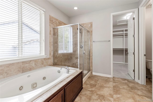 4545 Oxbow Dr, Brighton, CO 80601 - bathroom featuring a shower stall, toilet, a whirlpool tub, and a spacious closet