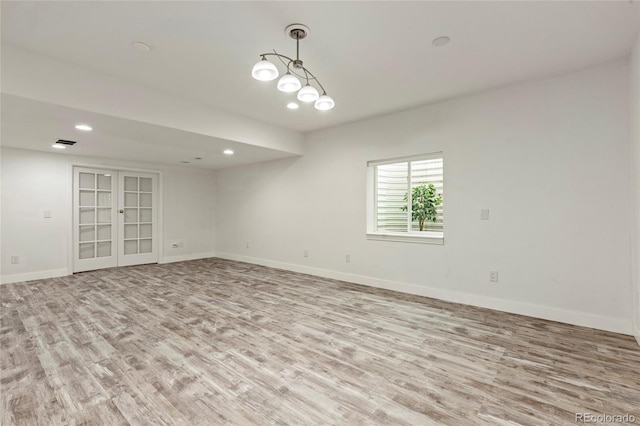 4545 Oxbow Dr, Brighton, CO 80601 - spare room with wood finished floors, baseboards, recessed lighting, and french doors