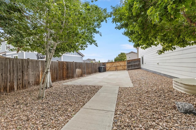 4545 Oxbow Dr, Brighton, CO 80601 - fenced backyard featuring a gate and a patio area
