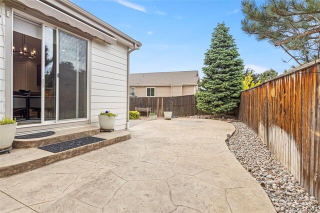 4545 Oxbow Dr, Brighton, CO 80601 - fenced backyard with a patio area