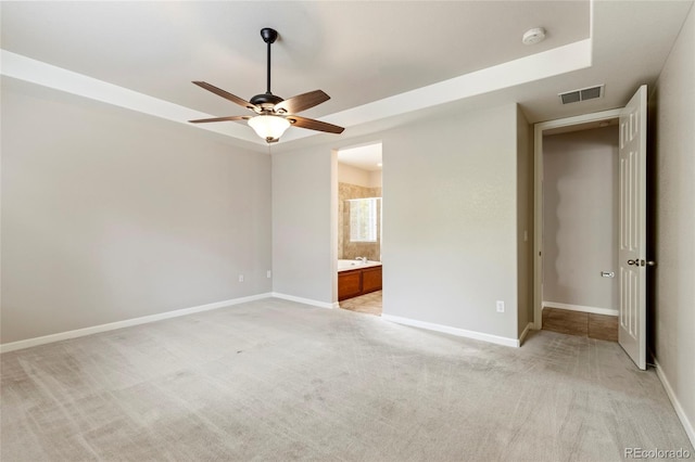 4545 Oxbow Dr, Brighton, CO 80601 - unfurnished bedroom with light carpet, baseboards, connected bathroom, and a ceiling fan
