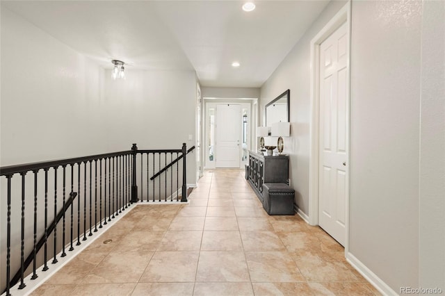 4545 Oxbow Dr, Brighton, CO 80601 - corridor featuring an upstairs landing, recessed lighting, baseboards, and light tile patterned floors