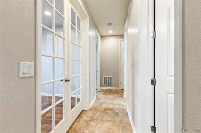 4545 Oxbow Dr, Brighton, CO 80601 - hall featuring french doors, a textured wall, recessed lighting, and baseboards