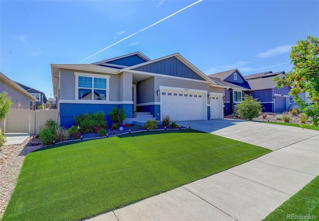 view of front of home with a garage and a front yard