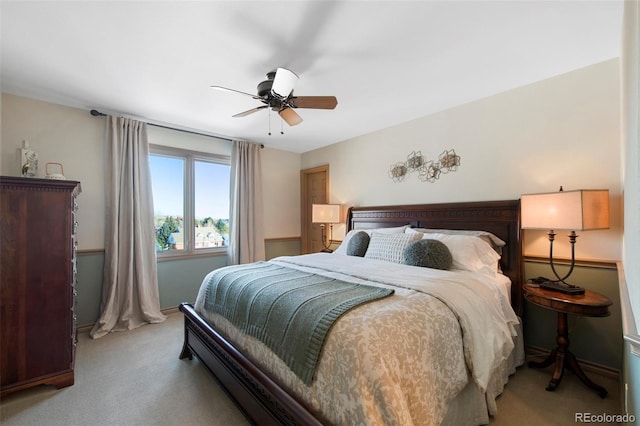 bedroom with light colored carpet and ceiling fan