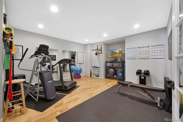 workout room with hardwood / wood-style floors