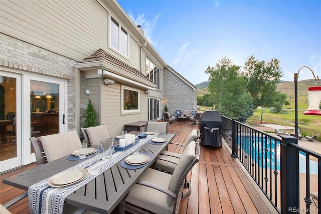 wooden deck featuring area for grilling