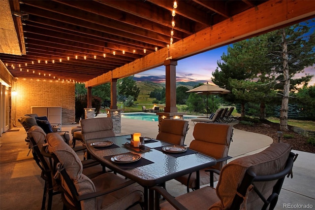 view of patio terrace at dusk