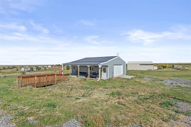 8979 Lariat Loop, Elizabeth, CO 80107 - view of green lawn with a detached garage