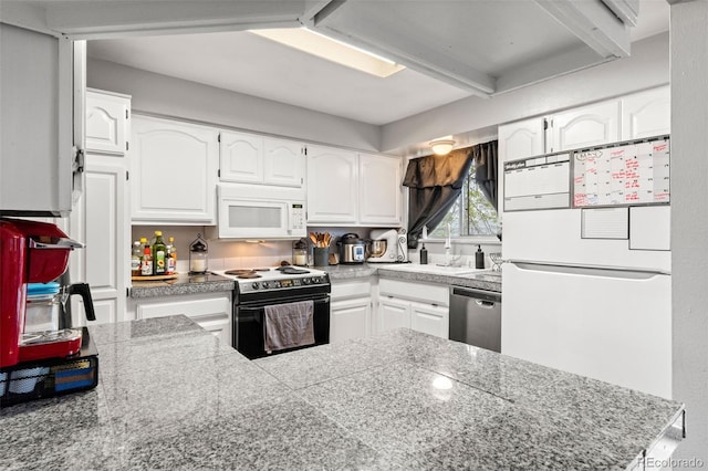 kitchen featuring white appliances, white cabinets, tile countertops, and a sink