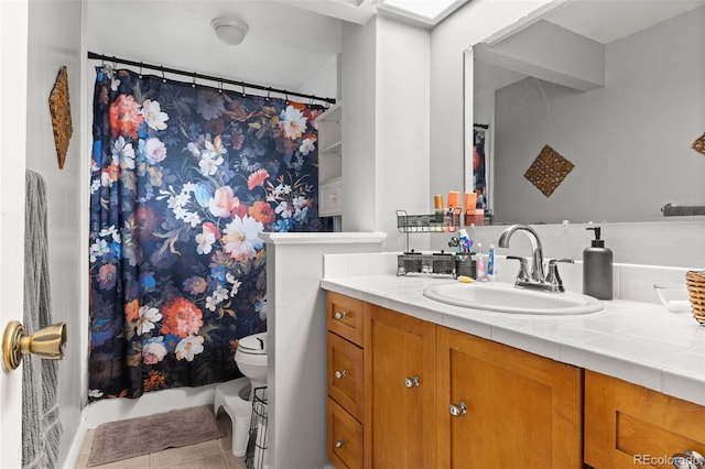 full bathroom with vanity, curtained shower, toilet, and tile patterned floors