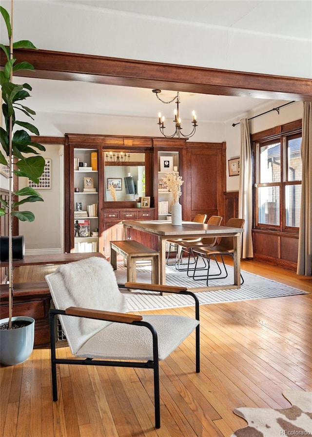 dining room featuring an inviting chandelier and light hardwood / wood-style floors