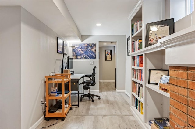 office with light hardwood / wood-style flooring