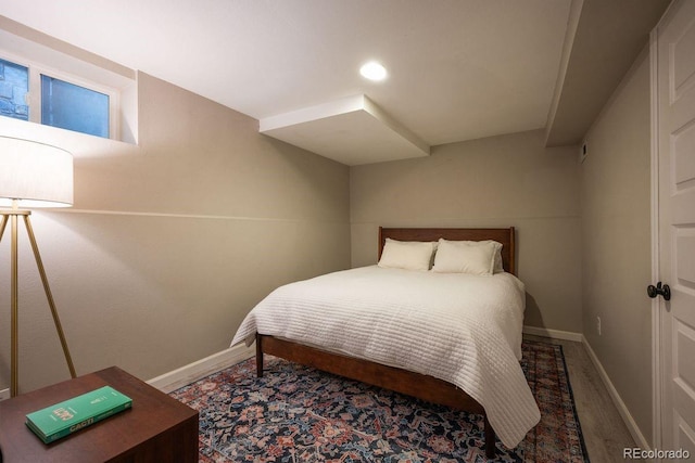 bedroom with wood-type flooring