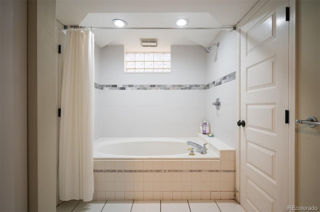 bathroom with tile patterned floors and shower / bath combo with shower curtain