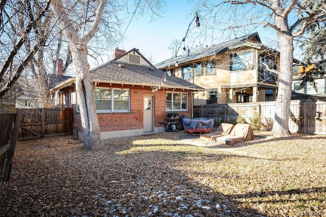 rear view of house with a patio