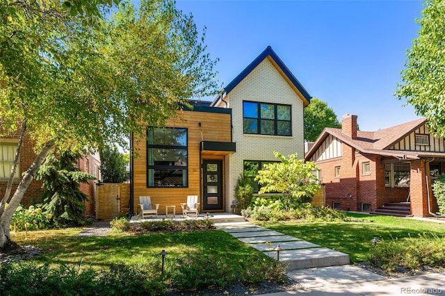 619 S High St, Denver, CO 80209 - view of front of property featuring brick siding