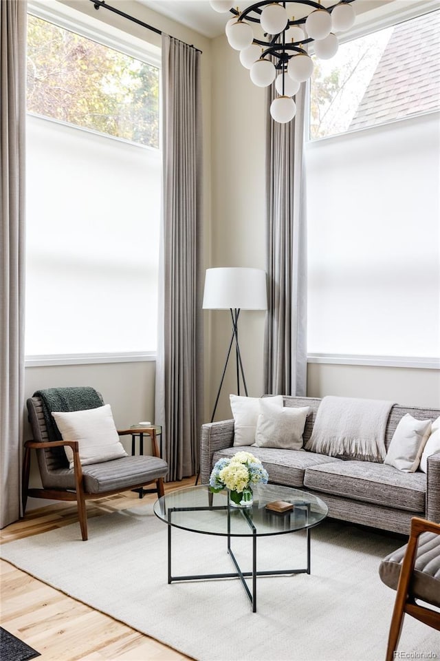 619 S High St, Denver, CO 80209 - living room featuring a chandelier and wood finished floors