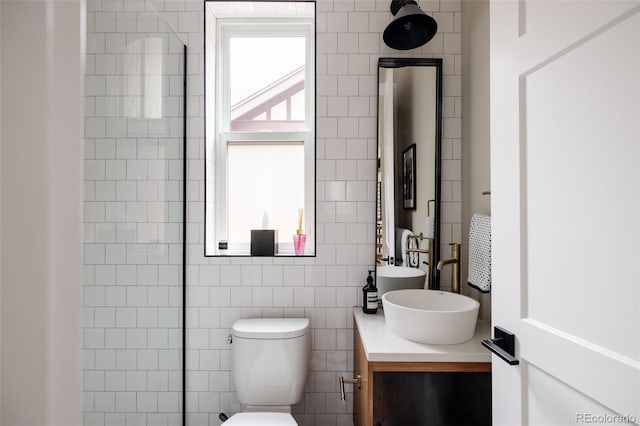 619 S High St, Denver, CO 80209 - full bath with vanity, toilet, and tile walls