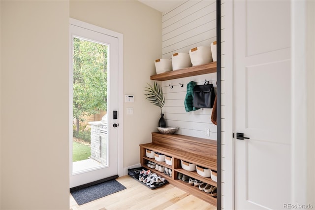 619 S High St, Denver, CO 80209 - mudroom featuring wood finished floors and wood walls